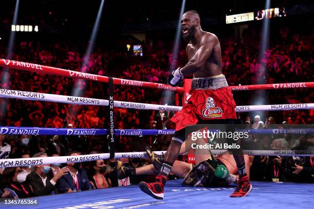 Deontay Wilder reacts after knocking down Tyson Fury in the fourth round during their WBC heavyweight title fight at T-Mobile Arena on October 09,...