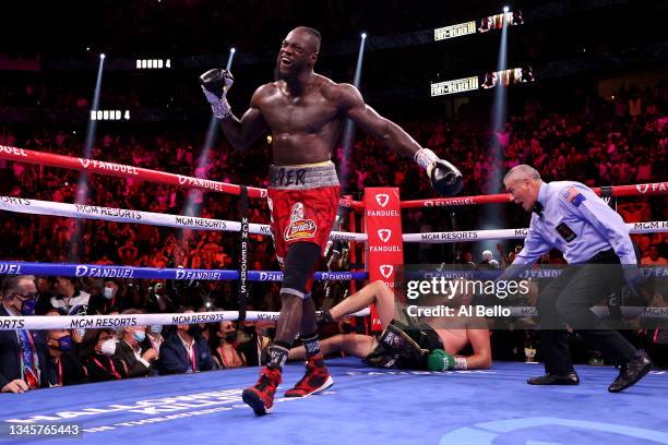 Deontay Wilder reacts after knocking down Tyson Fury in the fourth round during their WBC heavyweight title fight at T-Mobile Arena on October 09,...