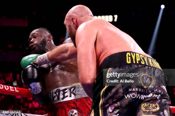 Tyson Fury punches Deontay Wilder during their WBC heavyweight title fight at T-Mobile Arena on October 09, 2021 in Las Vegas, Nevada.