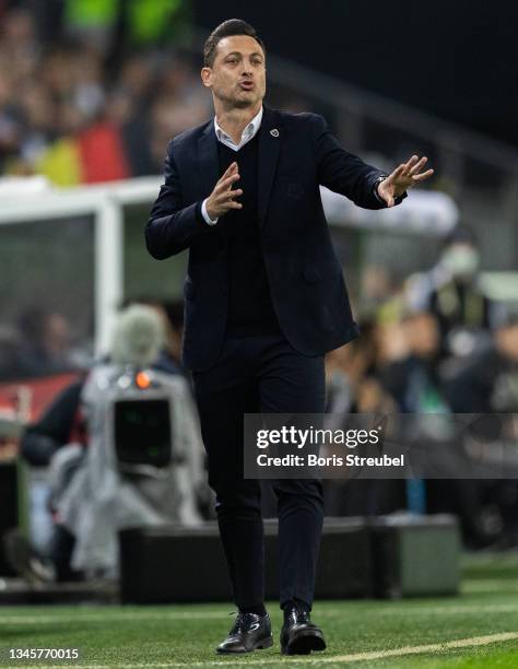 Head coach Mirel Radoi of Romania gestures during the 2022 FIFA World Cup Qualifier match between Germany and Romania at Imtech Arena on October 08,...