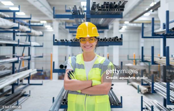 portrait of female warehouse worker at factory - steel furniture stock pictures, royalty-free photos & images