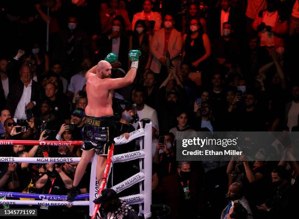 Tyson Fury celebrates his 11th-round knockout of Deontay Wilder to retain his WBC heavyweight title at T-Mobile Arena on October 9, 2021 in Las...