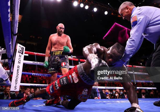 Deontay Wilder is knocked out by Tyson Fury in the 11th round during their WBC heavyweight title fight at T-Mobile Arena on October 09, 2021 in Las...