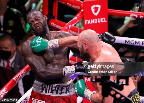 Tyson Fury hits Deontay Wilder in the eighth round of their WBC heavyweight title fight at T-Mobile Arena on October 9, 2021 in Las Vegas, Nevada....