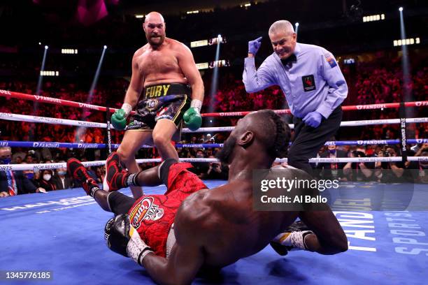 Tyson Fury reacts after knocking down Deontay Wilder in the third round of their WBC Heavyweight Championship title fight at T-Mobile Arena on...