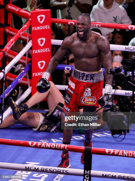 Deontay Wilder reacts after knocking Tyson Fury down in the fourth round of their WBC heavyweight title fight at T-Mobile Arena on October 9, 2021 in...