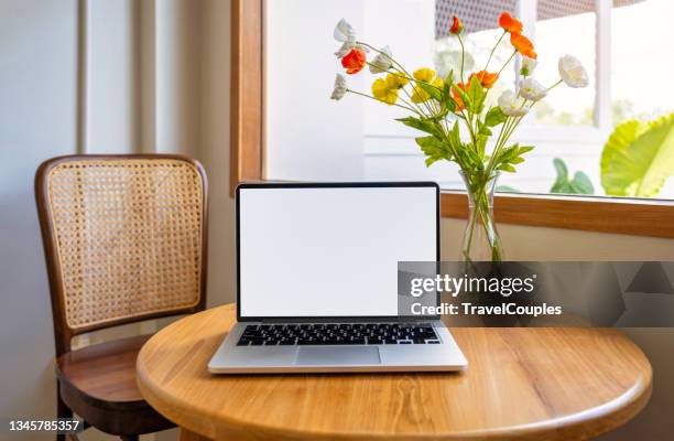 laptop computer blank screen on table in cafe background. laptop with blank screen on table of coffee shop blur background. - coffee cup mockup stock pictures, royalty-free photos & images
