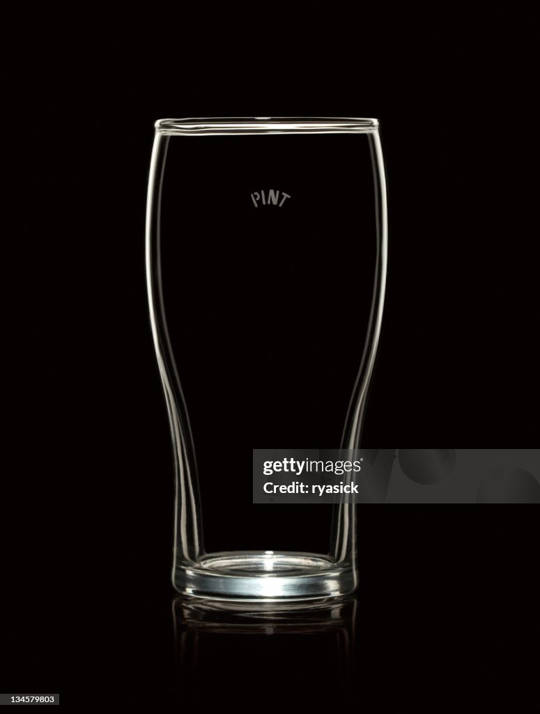 Empty Pint Beer Glass Isolated on Black Background