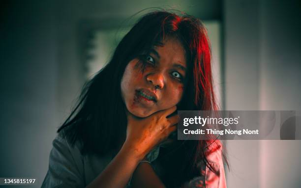 portrait of asian woman make up ghost face with blood, horror scene, scary background, halloween poster, thailand people. halloween. horror film. - zombie stock pictures, royalty-free photos & images