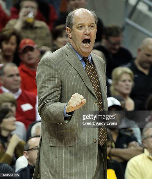Kevin Stallings the head coach of the Vanderbilt Commodores gives instructions to his team during the game against the Louisville Cardinals at KFC...