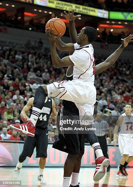 Russ Smith of the Louisville Cardinals shoots the ball against the Vanderbilt Commodores during the game at KFC YUM! Center on December 2, 2011 in...