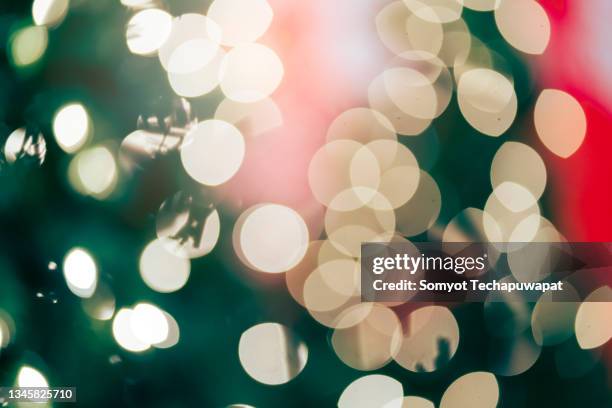 festive christmas and newyear background light night blur bokeh on christmas tree, light bokeh background. - german greens party stockfoto's en -beelden