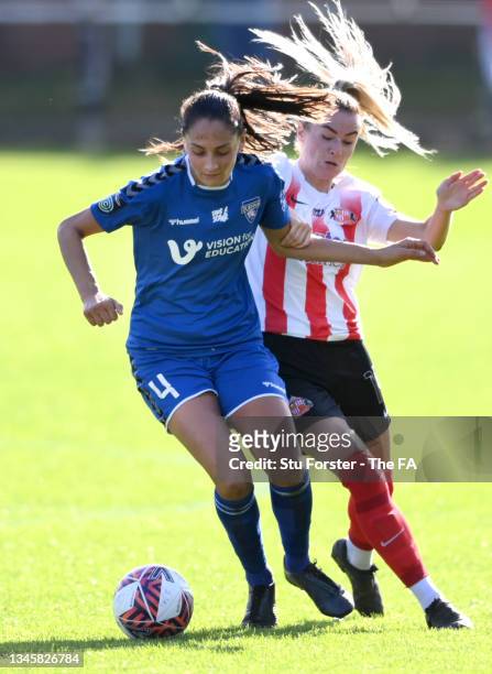 Durham player Mollie Lambert holds off the challenge of Emma Kelly of Sunderland during the Barclays FA Women's Championship match between Sunderland...