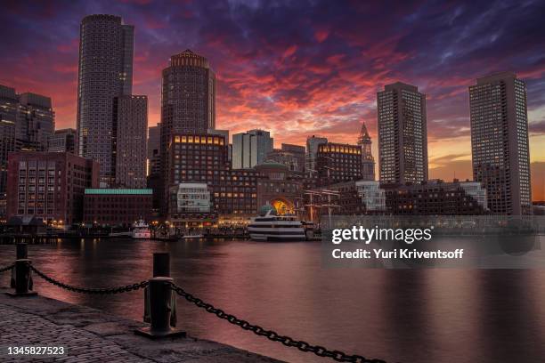 boston harbor and financial district at the sunset - boston seaport stockfoto's en -beelden