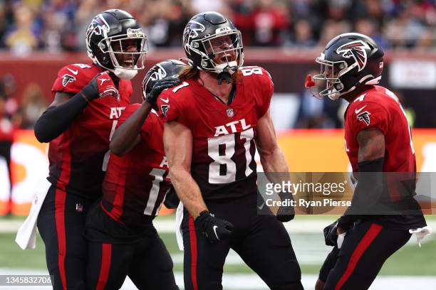 Hayden Hurst of the Atlanta Falcons celebrates with his team after he scores a touch down during the NFL London 2021 match between New York Jets and...