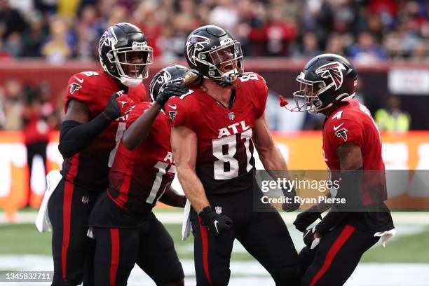 Hayden Hurst of the Atlanta Falcons celebrates with his team after he scores a touch down during the NFL London 2021 match between New York Jets and...