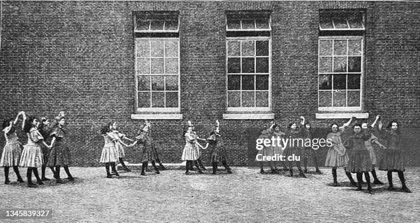 physical exercise on the schoolyard - school playground uk stock illustrations