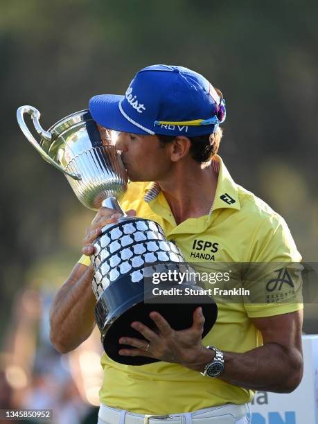 Rafa Cabrera-Bello of Spain celebrates with the winners trophy after the final round of The Open de Espana at Club de Campo Villa de Madrid on...