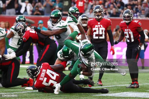 Michael Carter of the New York Jets scores a touchdown during the NFL London 2021 match between New York Jets and Atlanta Falcons at Tottenham...