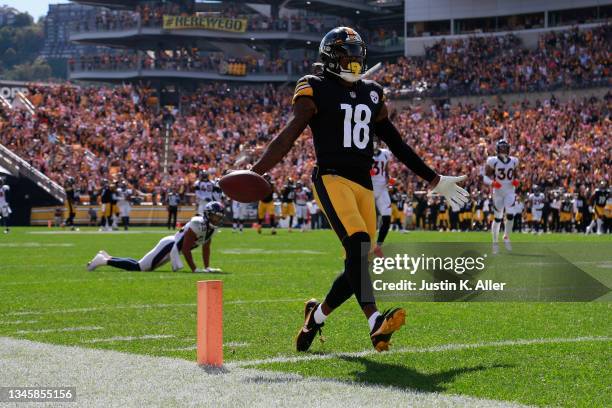 Diontae Johnson of the Pittsburgh Steelers crosses the goal line to score a 50-yard touchdown reception against the Denver Broncos during the first...