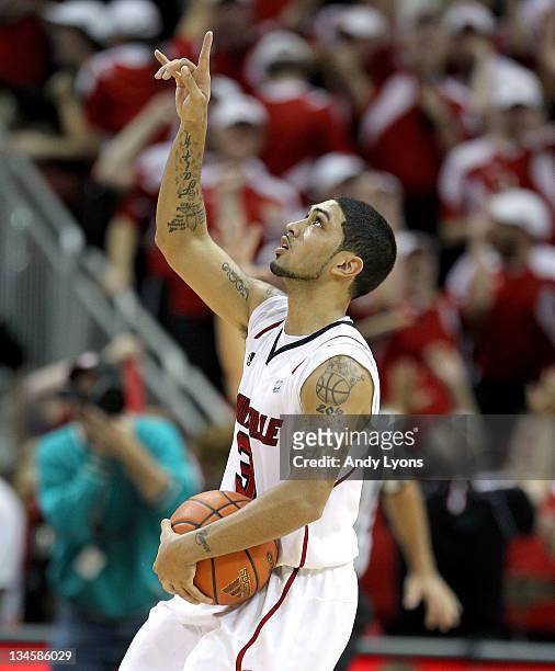 Peyton Siva of the Louisville Cardinals celebrates after hittining the winning shot in overtime to beat the Vanderbilt Commodores 62-60 in the game...