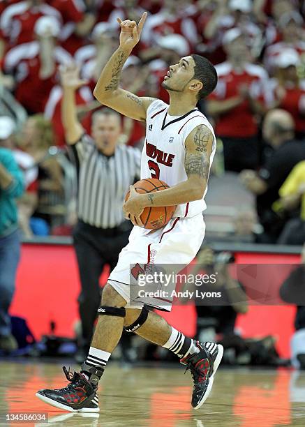 Peyton Siva of the Louisville Cardinals celebrates after hitting the winning shot in overtime to beat the Vanderbilt Commodores 62-60 in the game at...