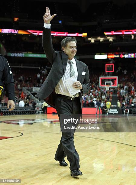 Rick Pitino the head coach of the Louisville Cardinals celebrates after Louisville beat the Vanderbilt Commodores 62-60 in the game at KFC YUM!...