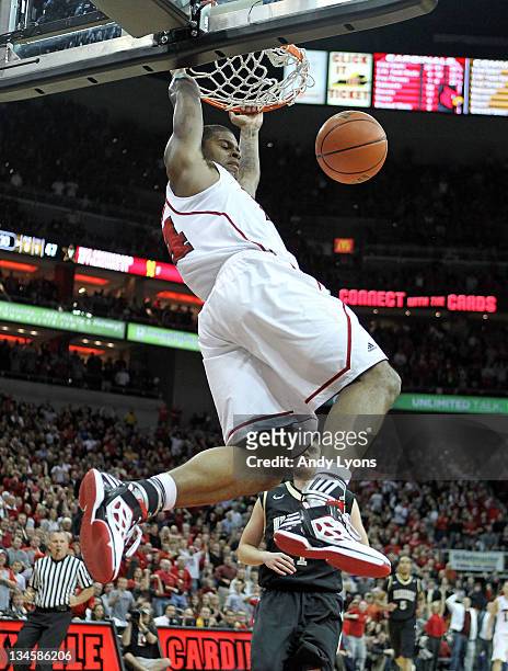 Chane Behanan of the Louisville Cardinals dunks the ball during the game the against Vanderbilt Commodores at KFC YUM! Center on December 2, 2011 in...