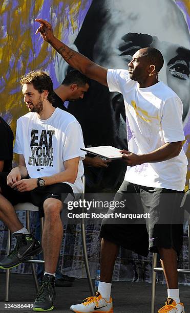 Pau Gasol and Kobe Bryant of the Los Angeles Lakers follow the final of the 'House of Hoops' contest by Foot Locker on October 6, 2010 in Barcelona,...