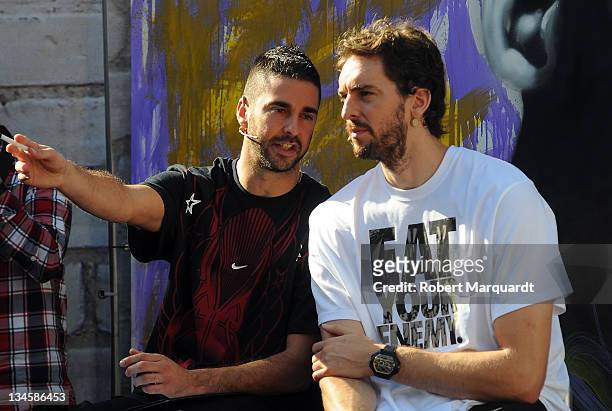 Juan Carlos Navarro of Regal FC Barcelona and Pau Gasol of the Los Angeles Lakers follow the final of the 'House of Hoops' contest by Foot Locker on...