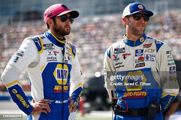 Chase Elliott, driver of the NAPA Auto Parts Chevrolet, and crew chief Alan Gustafson wait on the grid prior to the NASCAR Cup Series Bank of America...