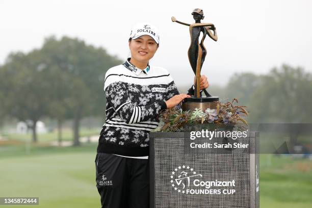 Jin Young Ko of Korea poses with the trophy on the 18th hole after winning the final round of the Cognizant Founders Cup at Mountain Ridge Country...