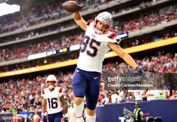 Hunter Henry of the New England Patriots celebrates a touchdown during the second half against the Houston Texans at NRG Stadium on October 10, 2021...
