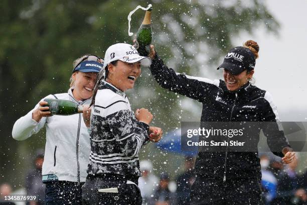 Gabby Lopez of Mexico and Brooke M. Henderson of Canada pour champagne on Jin Young Ko of Korea after her win during the final round of the Cognizant...