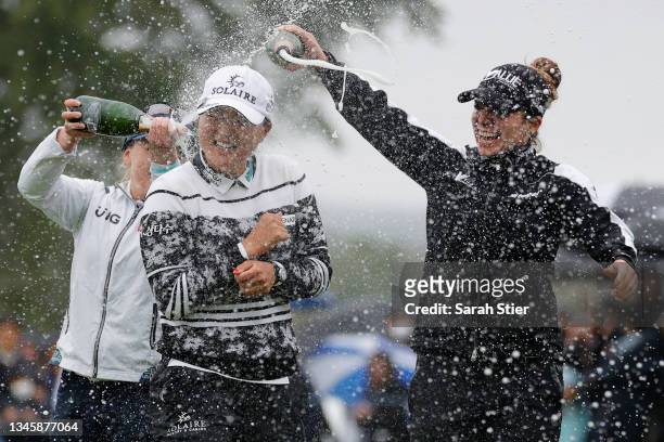 Gabby Lopez of Mexico and Brooke M. Henderson of Canada pour champagne on Jin Young Ko of Korea after her win during the final round of the Cognizant...