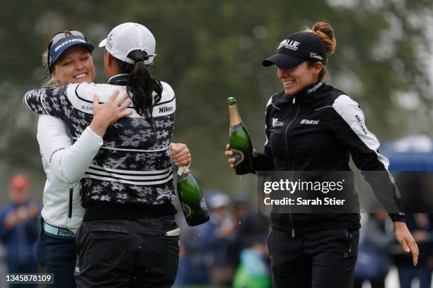 Gabby Lopez of Mexico and Brooke M. Henderson of Canada celebrate with Jin Young Ko of Korea after her win during the final round of the Cognizant...