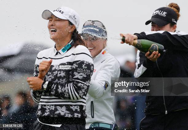 Gabby Lopez of Mexico and Brooke M. Henderson of Canada pour champagne on Jin Young Ko of Korea after her win during the final round of the Cognizant...