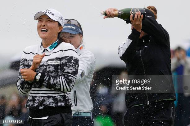 Gabby Lopez of Mexico and Brooke M. Henderson of Canada pour champagne on Jin Young Ko of Korea after her win during the final round of the Cognizant...