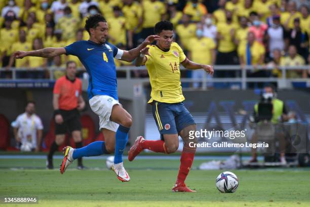 Luis Diaz of Colombia fights for the ball with Marquinhos of Brazil during a match between Colombia and Brazil as part of South American Qualifiers...