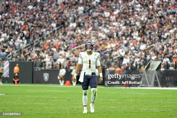 Justin Fields of the Chicago Bears reacts during the first half against the Las Vegas Raiders at Allegiant Stadium on October 10, 2021 in Las Vegas,...