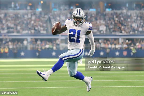 Ezekiel Elliott of the Dallas Cowboys runs the ball for a touchdown during the third quarter against the New York Giants at AT&T Stadium on October...