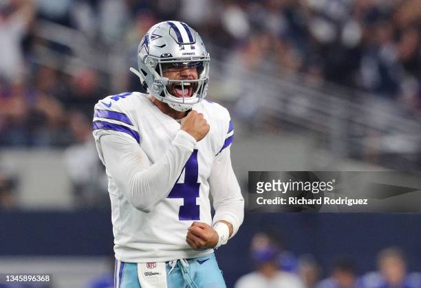Dak Prescott of the Dallas Cowboys celebrates a score during the fourth quarter against the New York Giants at AT&T Stadium on October 10, 2021 in...