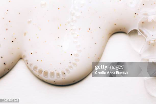 texture of white body scrub with air bubbles on white background. flat lay style - oily skin stock pictures, royalty-free photos & images