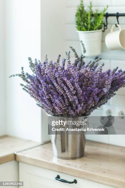 dried lavender in metal bucket on wooden kitchen. - lavendar stock pictures, royalty-free photos & images