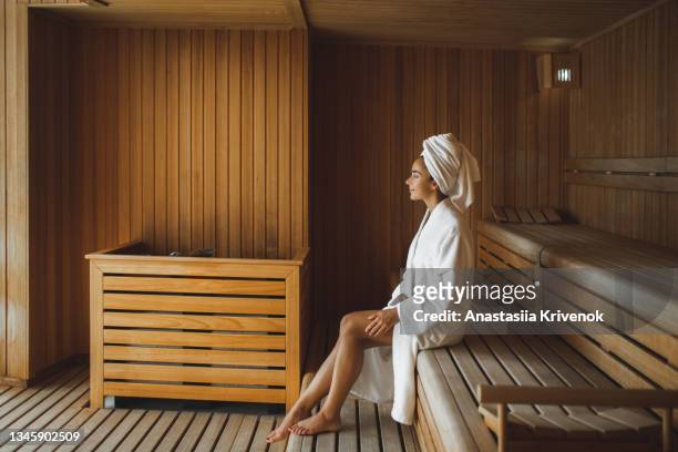 young beautiful slim woman relaxing in spa. - sauna stock pictures, royalty-free photos & images