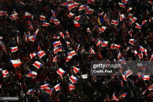 Fans of Chile cheer for their team during a match between Chile and Paraguay as part of South American Qualifiers for Qatar 2022 at Estadio San...