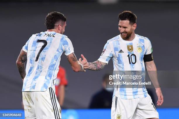 Rodrigo De Paul of Argentina celebrates with teammate Lionel Messi after scoring Rodrigo De Paul of Argentina during a match between Argentina and...