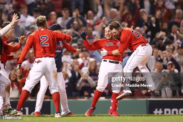 Christian Vazquez of the Boston Red Sox celebrates his game winning two-run homerun with teammates in the 13th inning against the Tampa Bay Rays...