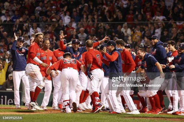 Christian Vazquez of the Boston Red Sox celebrates his game winning two-run homerun with teammates in the 13th inning against the Tampa Bay Rays...