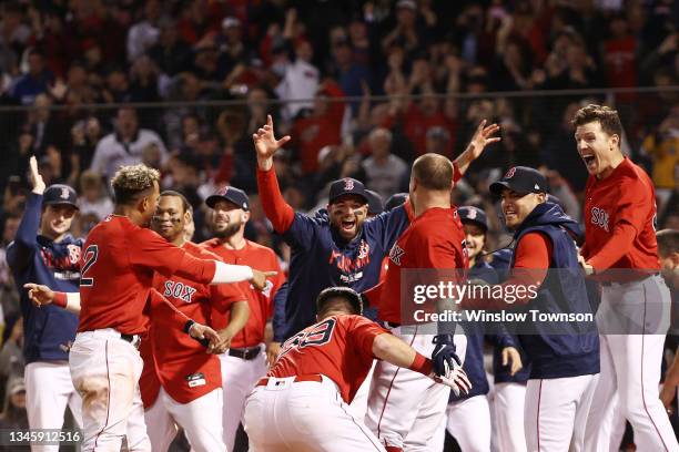 Christian Vazquez of the Boston Red Sox celebrates his game winning two-run homerun with teammates in the 13th inning against the Tampa Bay Rays...